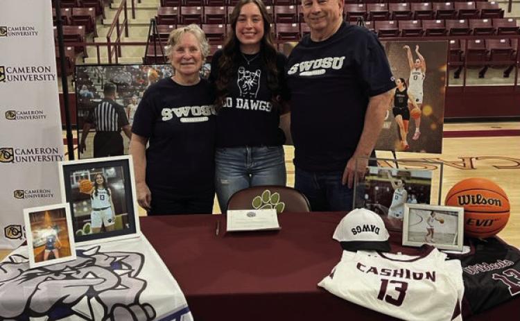 Cashion Wildcats point guard Lauren Jenkins signs with Southwestern Oklahoma State University Women's Basketball team. Jenkins is pictured with her Grandmother Donna Jenkins and Grandfather Larry Jenkins.