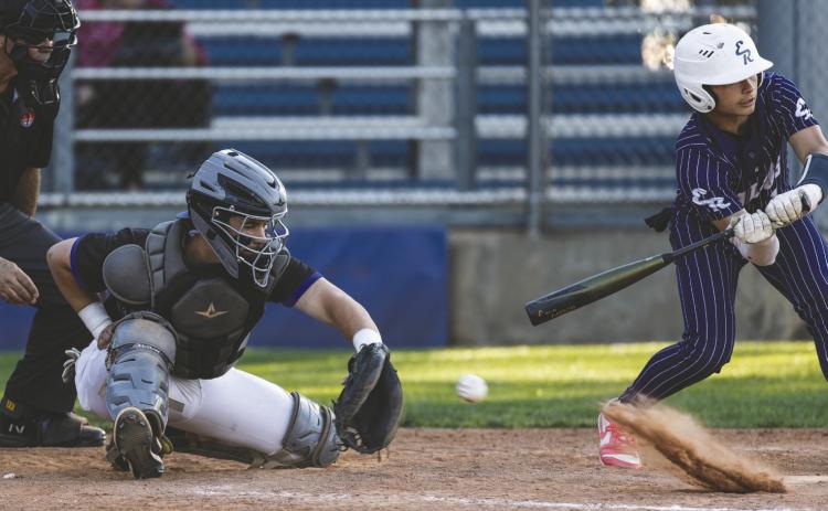Guthrie senior Owen Wilder (21) fields a bouncing pitch at the plate during a 17–1 win over El Reno on Monday, April 20 at Squires Field in Guthrie. Photo by Brent Fuchs