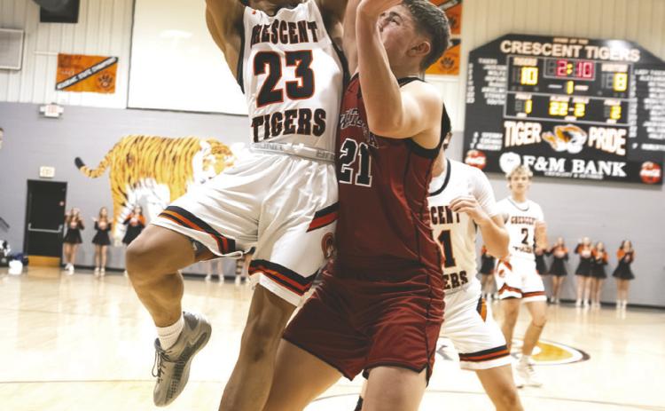 Crescent’s Chezdeon South scores goes up to score a basket during the 79-77 win over Watonga. Photo by Brent Fuchs