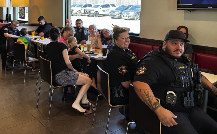 Pictured Above, Local Guthrie police officers and Logan County Sheriff’s deputies were at the local McDonalds last week for a meet and greet with customers. The event was held so that local residents could visit with the local law enforcement personnel in a neutral setting and ask questions. Photo by Trey Dallas