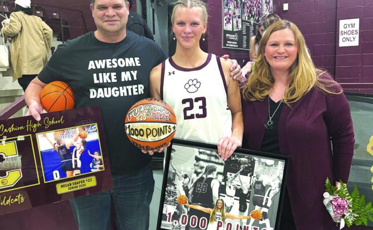 Cashion's Megan Shafer with her family during her 1000 point record hitting game Courtesy of Kim Shafer.