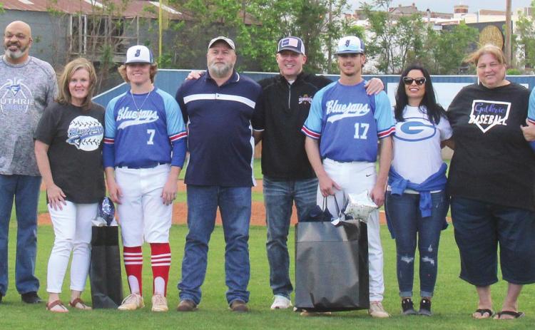 Pictured L-R, Guthrie baseball seniors Kia Codding with her parents Sonya and Ryan Codding; Jaylen Allison with parents Lamont and Rochelle Allison; Ty Biggs with parents Scott and Kim Biggs; Peyton Miller with parents Jeremy and Stephanie Miller; Josh Rains with parents Tonyua and John Rains; and Head Baseball Coach Casey Porter Photo by Mike Mohahan