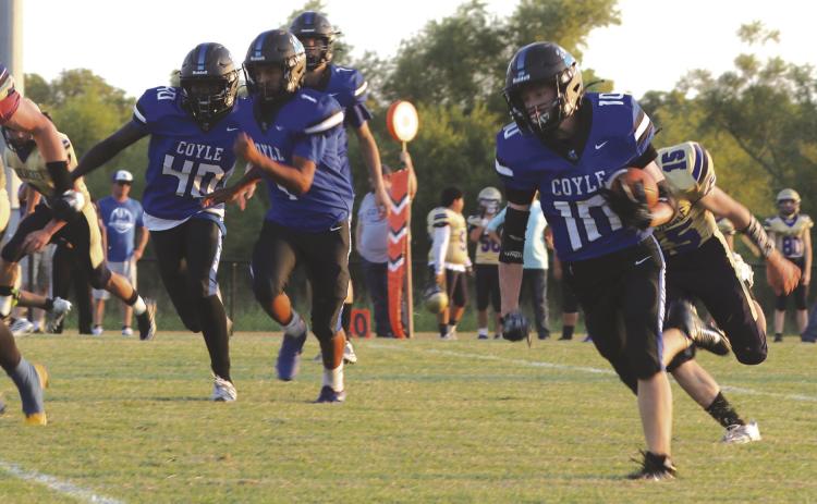 Coyle's Carson Hock on the way to one of his five touchdowns on September 13.