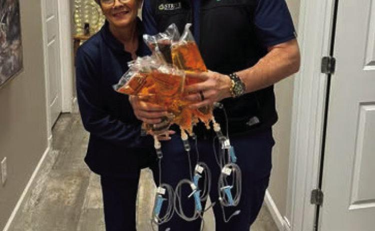 Stephen and Tina Hartzell ready to serve firefighters. Photo courtesy of Strive Wellness, Facebook.