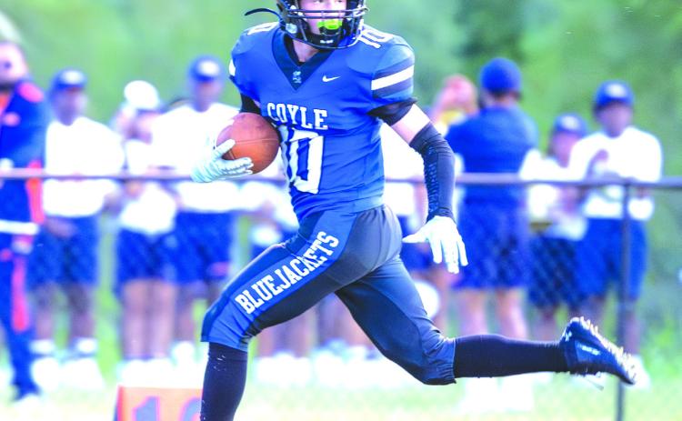 Coyle running back Carson Hock (#10) picks up some of his 225 yards on the ground against Yale on Sept. 5. Hock scored four touchdowns to lead the Bluejackets to a 48-32 win. Photo by Brent Fuchs.