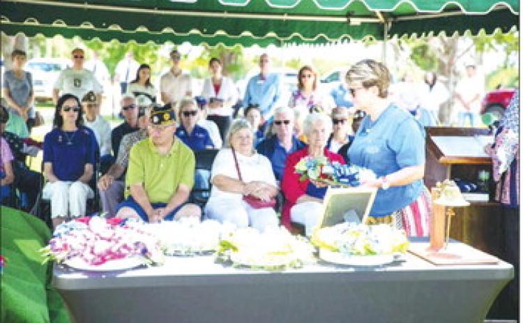 Nancy Knox of the Daughters of the American Revolution Samuel King Chapter participates in the wreath laying ceremony during the Memorial Day ceremony at Summit View Cemetery in Guthrie. Photo by Brent Fuchs