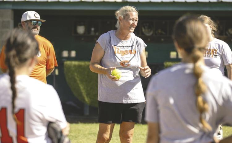 Crescent softball head coach addresses the team during practice as the Tigers prepare for the start of the upcoming season.