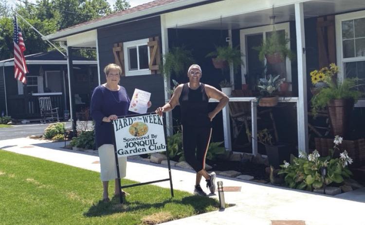 The Jonquil Garden Club has chosen to honor the Yard of the Week to Cheryl Craig-White, 1103 E Vilas. Pictured L to R: Pam Williams, representative of Jonquil Garden Club, and homeowner Cheryl Craig-White