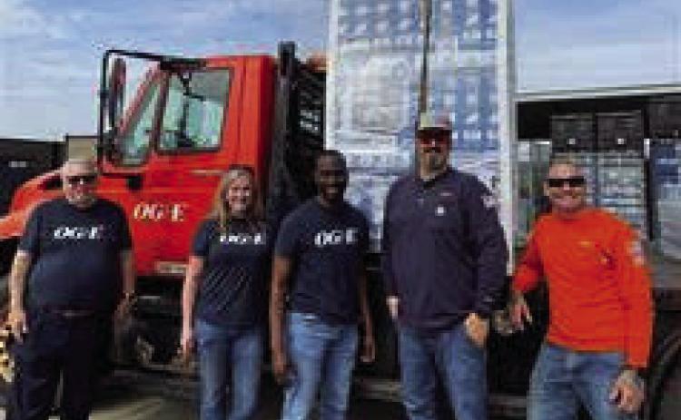 Left to right: OGE employees John Koons, Allison Terrill, Spencer Browne, Kyle Sexton and Victor Terán Jr. prepare to deliver fans to seniors and families with low income. The distribution is part of the electric company’s annual fan donation program.