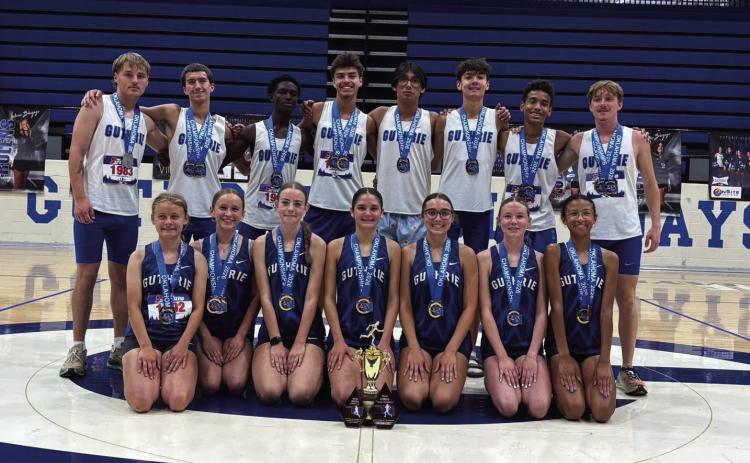 Guthrie’s Lady Jays and Bluejays celebrate with their medals following the Oklahoma 5A Public School Cross Country Championships Saturday at Cottonwood Flats. The Lady Jays captured the Class 5A team title, while the Bluejays finished second. Photo provided by GHS Facebook