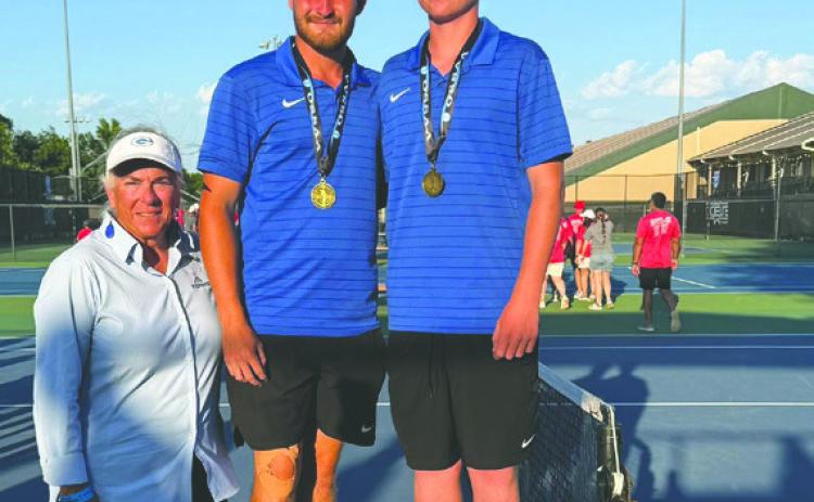Guthrie’s Carson Olmsted and Jaxson Mayer celebrate a thirdplace finish. Guthrie Tennis