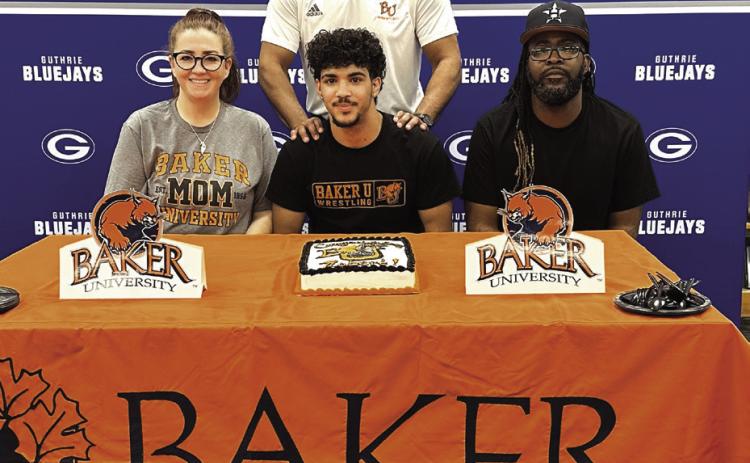 Guthrie senior wrestler Robert Brown signed a Letter of Intent with Baker University on April 29. Photo by Mike Monahan