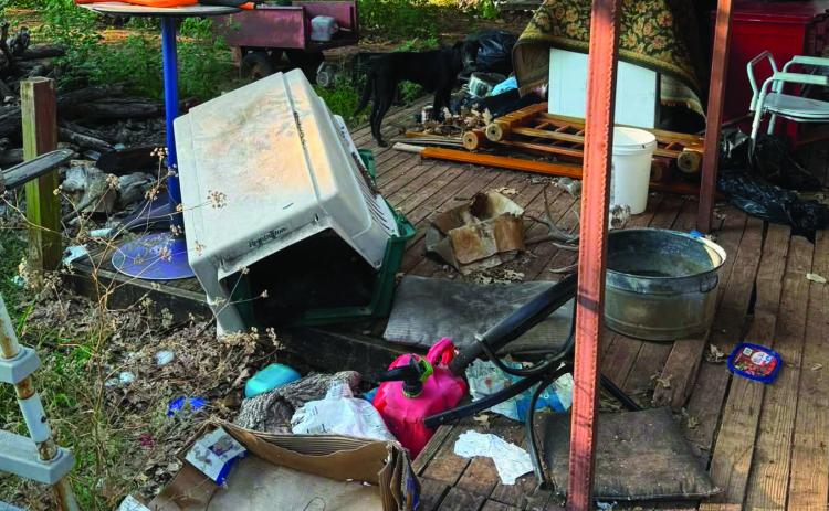 Debris, trash and evidence of severe neglect are visible outside a Logan County residence where investigators are conducting an animal cruelty investigation. Photo courtesy of The Humane Society of Tulsa.
