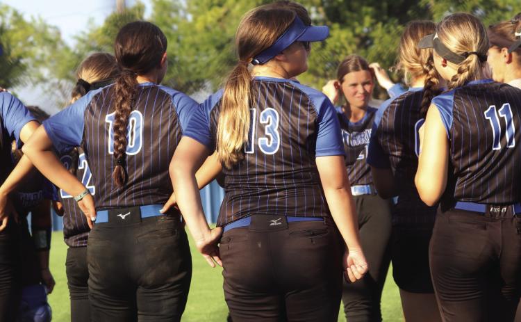 Lady Bluejays get words of wisdom from Coach Kara Tarrant after win.