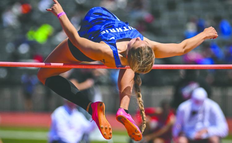 Senior Lily Rechlin clears a record-setting height in the high jump, establishing a new mark for Guthrie during recent competition. Photo courtesy of Guthrie Highschool XC/Track Facebook page.