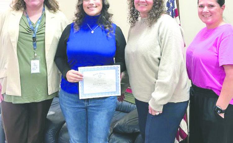 Pictured with Nikole is Ashley Garner with CASA for Kids, Rotarian Kristal Flury and Keri Scheihing with CASA for Kids.