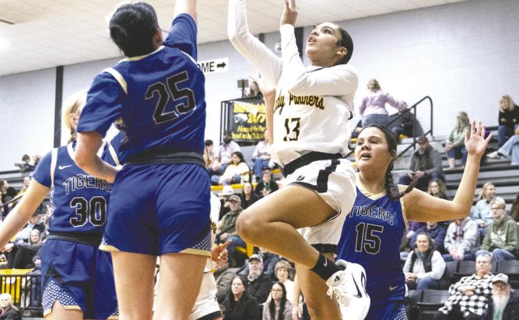 Mulhall-Orlando sophomore Raegan Graef shoots over a Shidler defender in the Lady Panthers’ 51-36 home win on Jan. 29. Graef led both teams with 20 points. Photo by Brent Fuchs